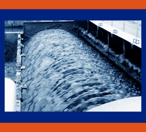 Industrial wastewater flowing through a treatment channel at a food processing plant